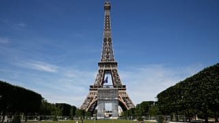 French soldiers patrol next to the Eiffel Tower on May 8, 2020 in Paris, as part of the celebrations for the anniversary of the Allied forces victory in Europe in WW2