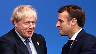 Britain's Prime Minister Boris Johnson (L) welcomes France's President Emmanuel Macron (R) London on December 4, 2019. (Photo by CHRISTIAN HARTMANN / POOL / AFP)