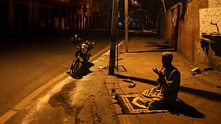 A Muslim worshipper offers prayer on a street outside the Jama Masjid on the first day of Ramadan during a nationwide lockdown, in New Delhi, India, Saturday, April 25, 2020