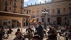 People enjoy drinks in Tarragona, Spain