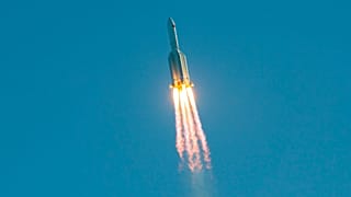 (FILES) This file photo taken on May 5, 2020 shows a Long March 5B rocket lifting off from the Wenchang launch site on China's southern Hainan island. 
