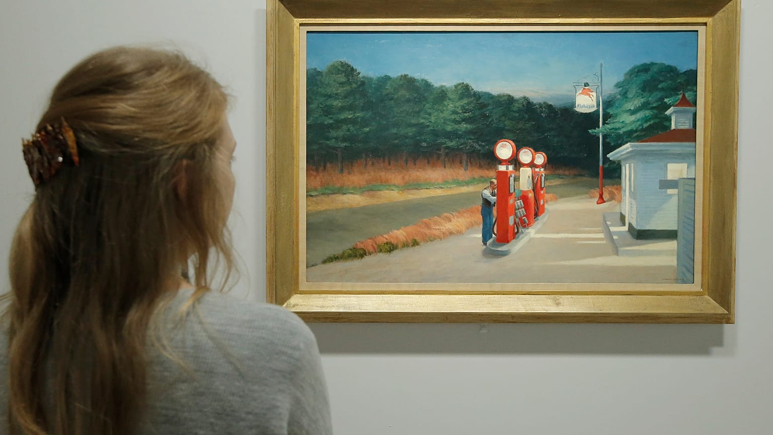A woman looks at "Gas 1940" as part of the retrospective of Edward Hopper, one of the great American 20th century artists in 2012.