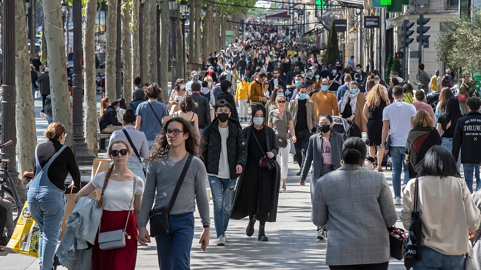 People wear face masks to help curb the spread of the coronavirus (File Photo)