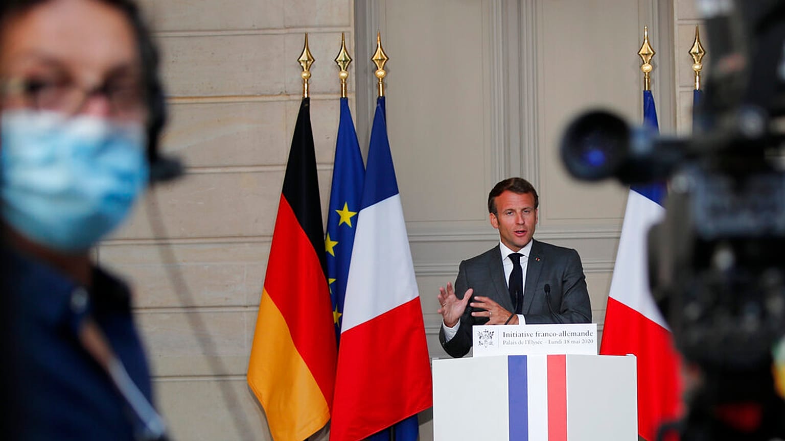 French President Emmanuel Macron speaks during a joint video press conference with German Chancellor Angela Merkel, at the Elysee Palace Monday, May 18, 2020 in Paris