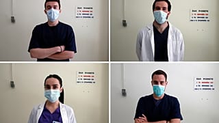 Nikolaos Katsanakis, top left, Ilias Sinanidis, top right, Anna Karagiannakou, bottom left, and Konstantinos Koufatzidis pose at the entrance of the COVID-19 Clinic at Sotiria