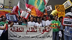 Abolish the Kafala system. Stop trying to deporting illegal domestic workers," during a rally to mark International Domestic Workers Day, in Beirut, Lebanon, Sunday, June 