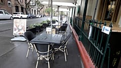 Tables go empty at a restaurant in Sydney, May 2020.