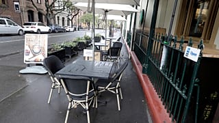 Tables go empty at a restaurant in Sydney, May 2020.