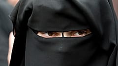 A veiled woman attends a speech by preacher Pierre Vogel, in Offenbach, near Frankfurt, Germany
