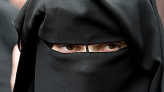 A veiled woman attends a speech by preacher Pierre Vogel, in Offenbach, near Frankfurt, Germany