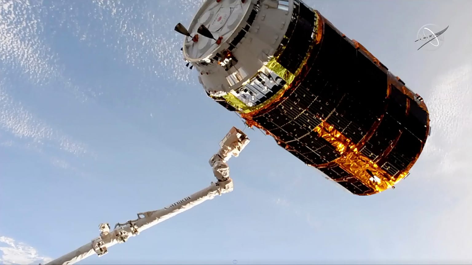 the Japan Aerospace Exploration Agency is released by a robotic arm from the International Space Station