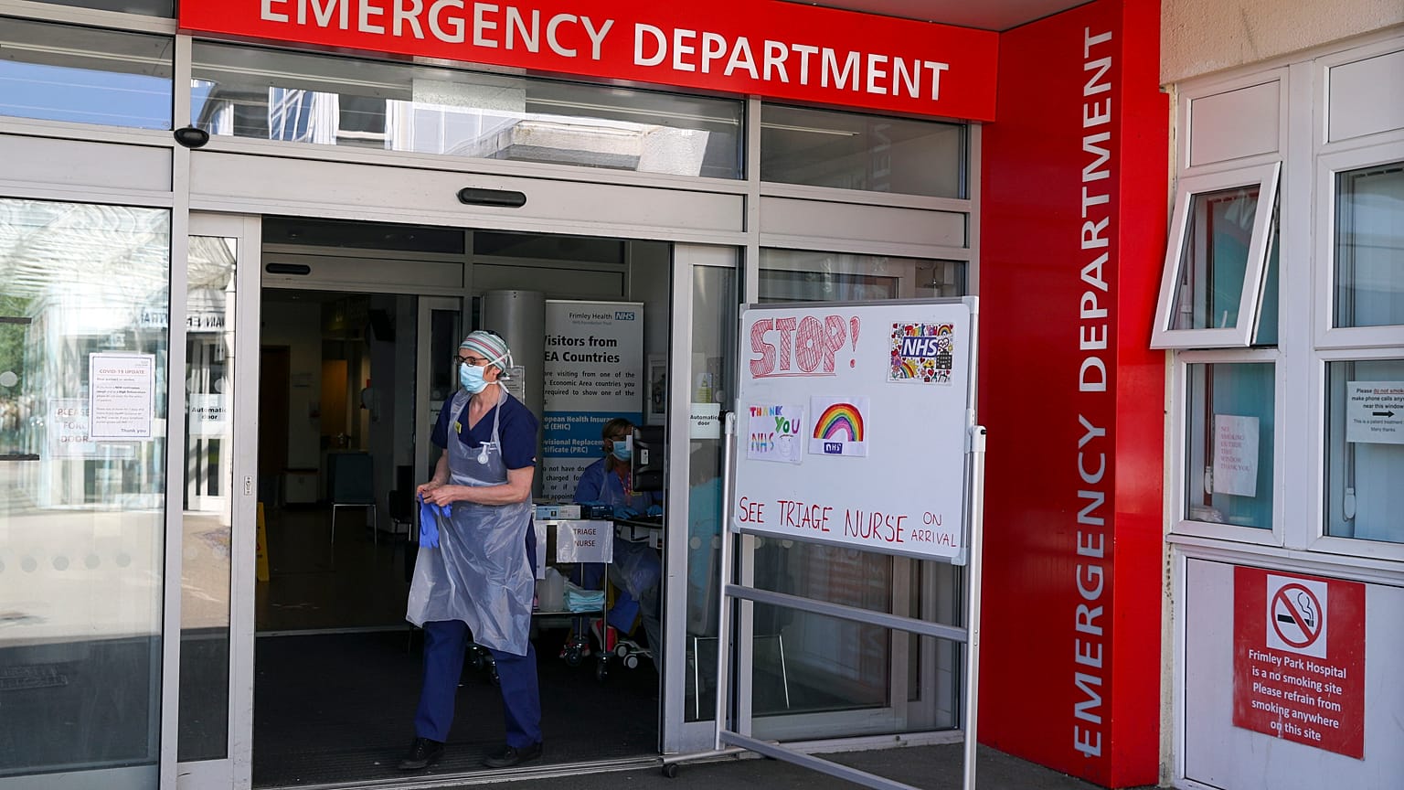 A triage nurse waits for patients to arrive in the Emergency Department at Frimley Park Hospital Frimley Park Hospital, in Camberley, England, May 22, 2020. 