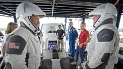 In this Aug. 13, 2019 file photo, NASA astronauts Doug Hurley, left, and Bob Behnken work with teams from NASA and SpaceX to rehearse crew extraction from SpaceX's Crew Dragon