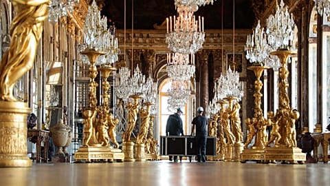 Workers in the Hall of Mirrors, cleaning 357 mirrors and decoration
