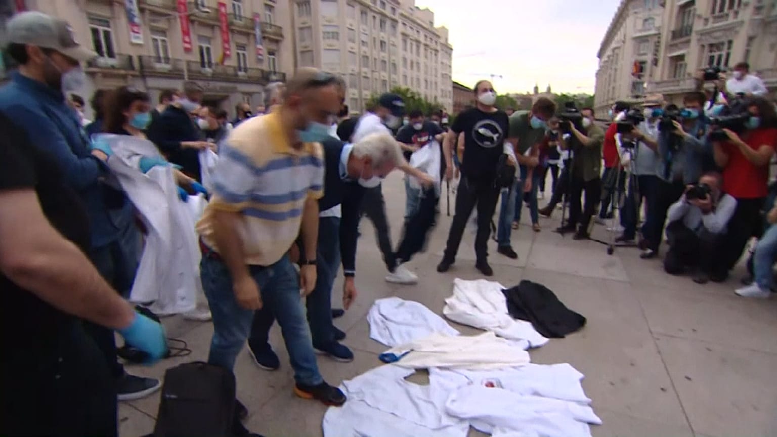 Chefs throwing their aprons to the ground