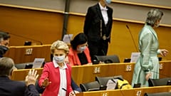 European Commission President Ursula von der Leyen, third left, speaks with MEP's prior to her opening address during the plenary at the European Parliament in Brussels