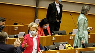 European Commission President Ursula von der Leyen, third left, speaks with MEP's prior to her opening address during the plenary at the European Parliament in Brussels