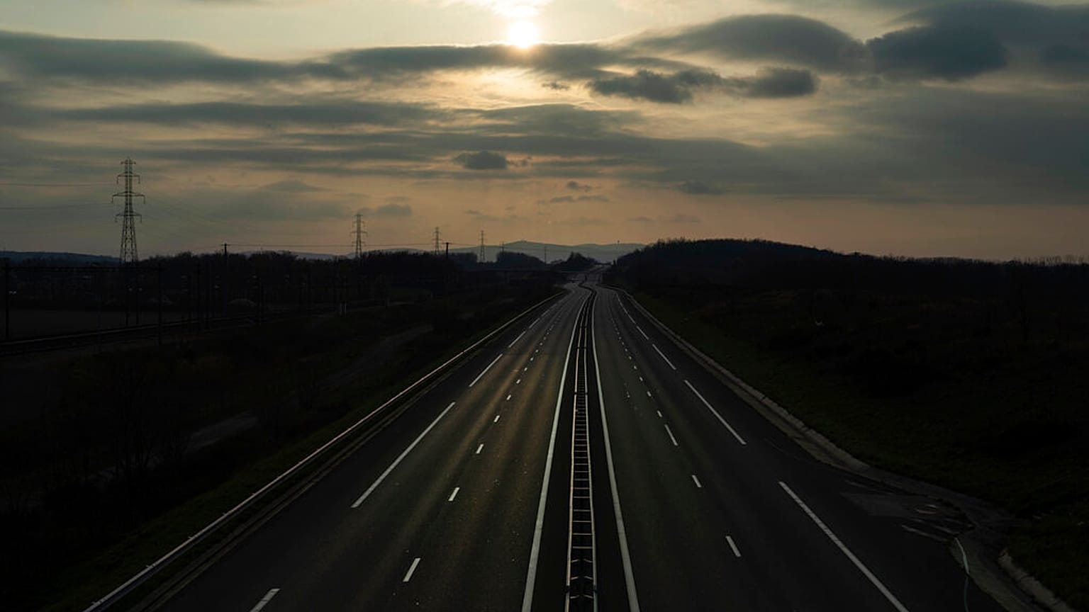 An empty highway is pictured outside Lyon, central France, Sunday, March 22, 2020. (AP Photo/Laurent Cipriani)