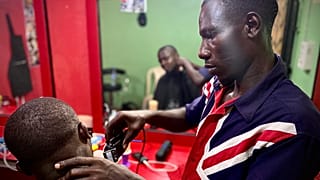 James, 30, has been helped to reintegrate into life in Nigeria after returning home from Libya. The IOM helped him to open a barbershop in Benin City, Edo State, Nigeria.