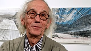 This Jan. 23, 2013 photo shows artist Christo in front of his proposed "Over the River" project at the Metropolitan State University Center for Visual Art in Denver, US.