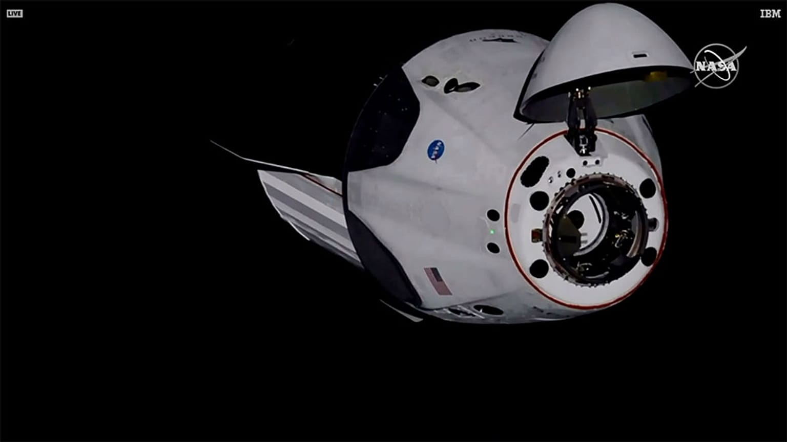 SpaceX Dragon crew capsule, with NASA astronauts, docks with the International Space Station