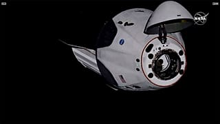 SpaceX Dragon crew capsule, with NASA astronauts, docks with the International Space Station