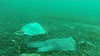 Discarded masks and plastic gloves litter the Mediterranean seabed near Antibes, France