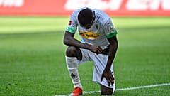 Moenchengladbach's Marcus Thuram taking the knee after scoring his side's second goal during the Bundesliga soccer match between Borussia Moenchengladbach and Union Berlin.
