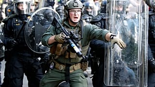 Police begin to clear demonstrators in Washington.