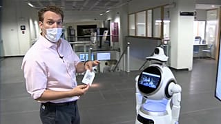 Euronews correspondent Jack Parrock trying out the Cruzr Health robot at the Antwerp University Hospital.