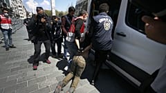 Turkish police officers arrest protesters