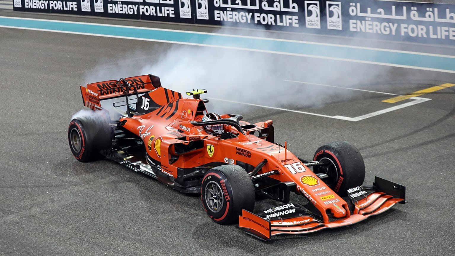Ferrari driver Charles Leclerc of Monaco celebrates at finish line after he placed third in the Emirates Formula One Grand Prix, Sunday, Dec.1, 2019.