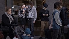 People hang out in the street in Stockholm, Sweden