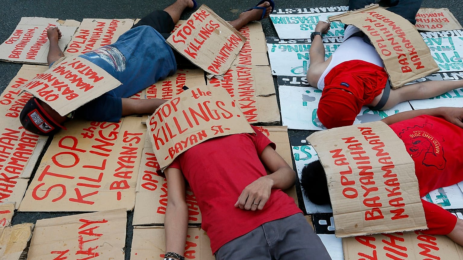 Students stage a die-in to protest the rise in extra-judicial killings in the Philippines "drugs war"