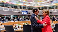 German Chancellor Angela Merkel, right, speaks with Cypriot President Nicos Anastasiades