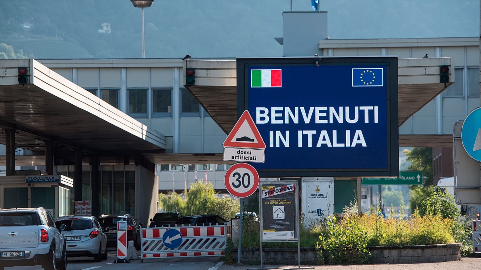 Cars cross the border station Chiasso Brogeda between Switzerland and Italy, in Chiasso, Switzerland, Wednesday, June 3, 2020. 