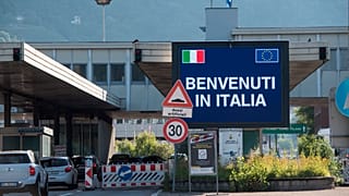 Cars cross the border station Chiasso Brogeda between Switzerland and Italy, in Chiasso, Switzerland, Wednesday, June 3, 2020. 