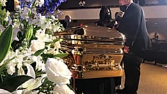 Martin Luther King III takes a moment by George Floyd's casket Thursday, June 4, 2020, before a memorial service for George Floyd in Minneapolis. 