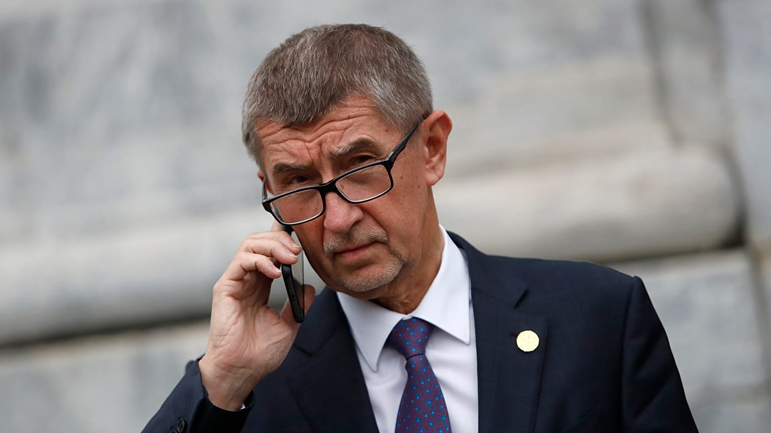 Czech Republic's Prime Minister Andrej Babis talks on the phone as he leaves after a meeting in Beja, Portugal, Saturday, Feb. 1, 2020