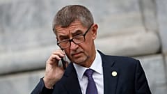 Czech Republic's Prime Minister Andrej Babis talks on the phone as he leaves after a meeting in Beja, Portugal, Saturday, Feb. 1, 2020