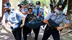 Kazakh police detain a demonstrator during a demonstration called by political opposition groups, Almaty, Kazakhstan, June 6, 2020. 