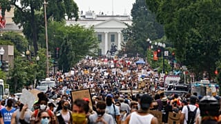Demonstrators protest Saturday, June 6, 2020, near the White House in Washington, over the death of George Floyd
