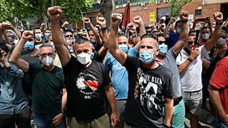People in Spain protest the closure on the Nissan plant in Barcelona. 
