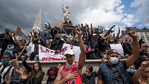 People chant slogans and hold placards, as they demonstrate in Nantes during a 'Black Lives Matter' worldwide protests against racism and police brutality. France