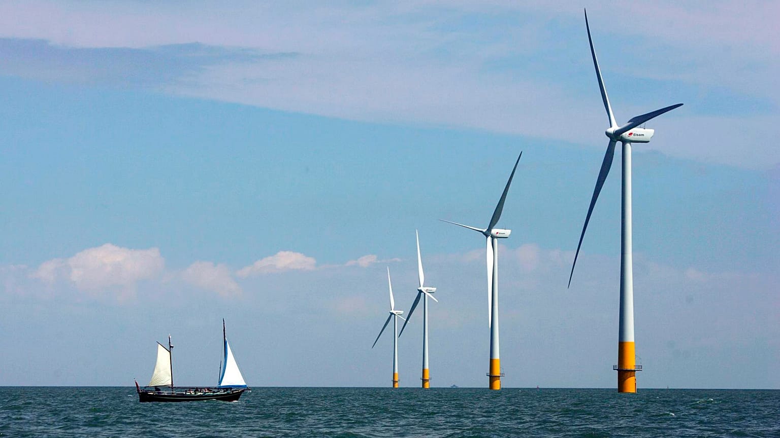 A vessel sails towards a wind farm off the coast of Whitstable on the north Kent coast in England.