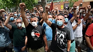 People in Spain protest the closure on the Nissan plant in Barcelona