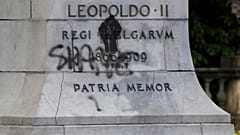 A statue of Belgium's King Leopold II is defaced with the words 'shame' prior to a Black Lives Matter protest rally in Brussels, Sunday, June 7, 2020. 