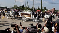 George Floyd's funeral procession arrives at Houston Memorial Gardens cemetery, Tuesday, June 9, 2020, in Pearland, Texas.