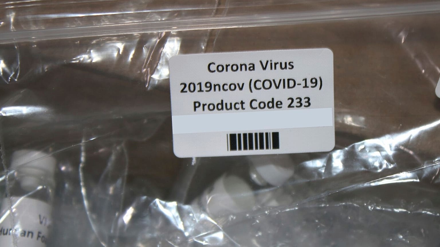 This March 12, 2020, photo released by the U.S. Customs and Border Protection, shows a package containing suspected counterfeit COVID-19 test kits arriving from UK.