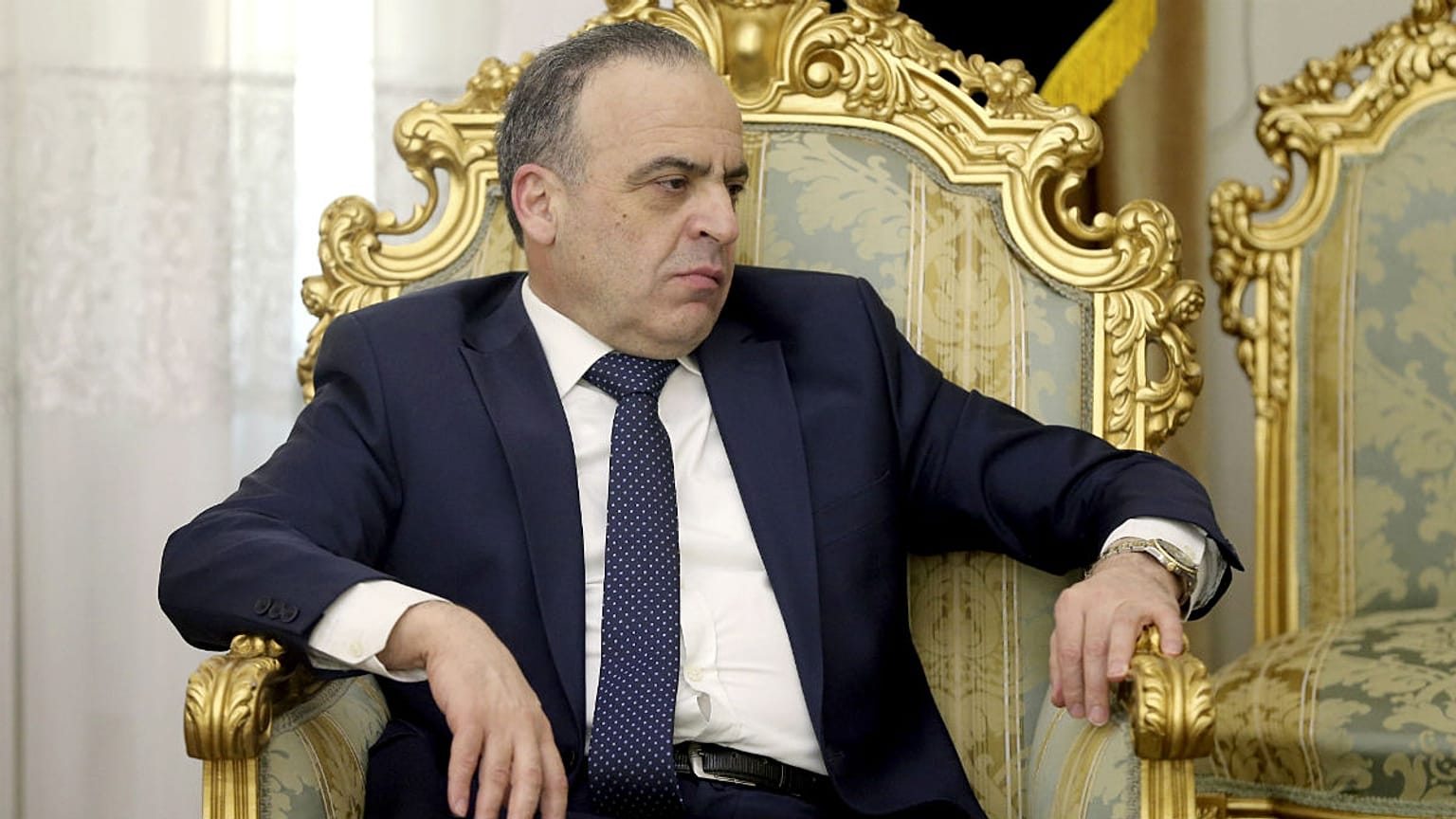 Syrian Prime Minister Imad Khamis listens to Secretary of Iran's Supreme National Security Council Ali Shamkhani in a meeting in Tehran, Iran.